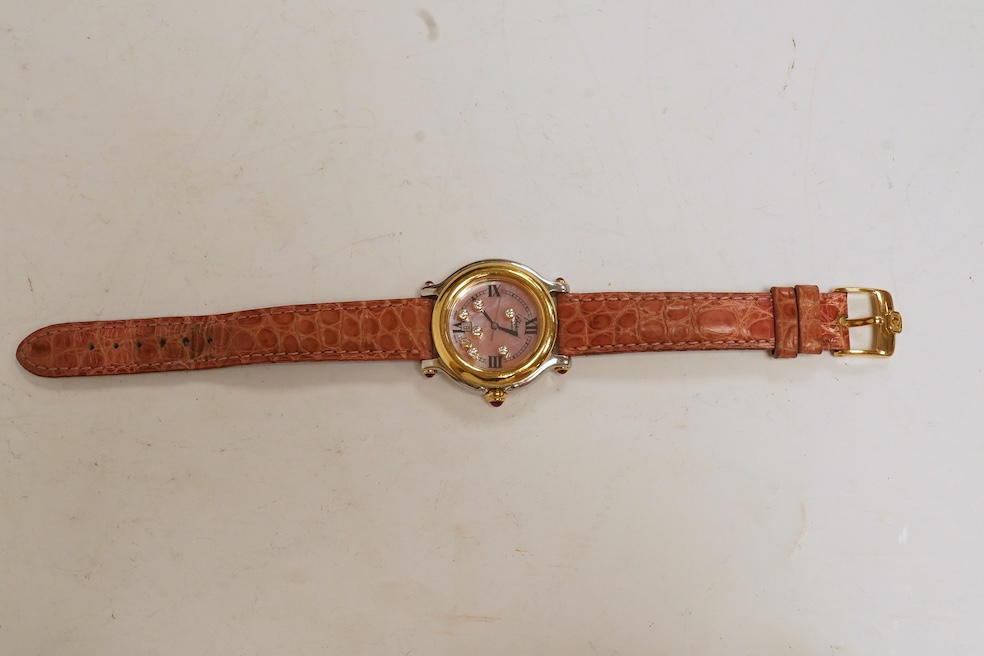 A lady's recent steel and gold Chopard 'Happy Sport' quartz wrist watch, the paua shell dial with seven 'floating' diamonds, on a leather strap wit gold plated Chopard clasp, with box, no papers. Condition - fair